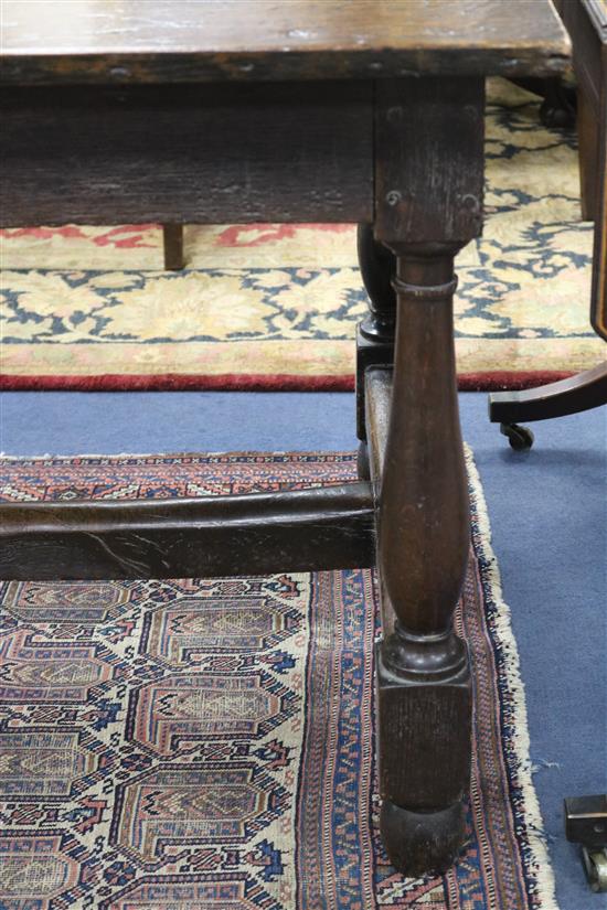 An 18th century style oak refectory table, W.196cm, D.86cm